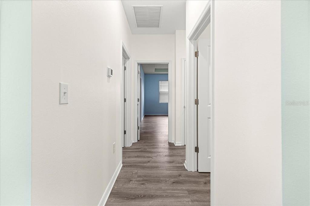 5851 Southwest 85th Place Ocala, FL 34476 - Photo 26 of 57 a view of a hallway with wooden floor