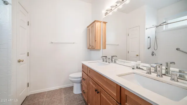 a bathroom with a sink toilet and mirror