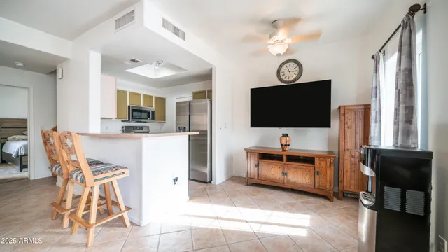 a view of living room with furniture and flat screen tv