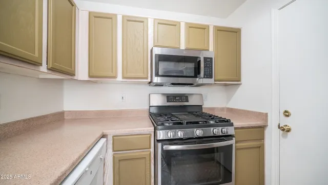 a kitchen with a stove and a microwave