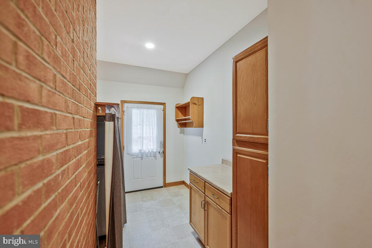 7185 Hawthorne Road La Plata, MD 20646 - Photo 26 of 59 Charming entryway with brick accents.
