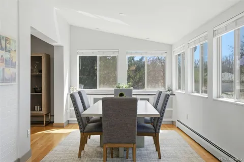 a living room with furniture and large windows