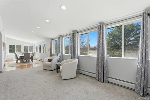 a living room with furniture and a table