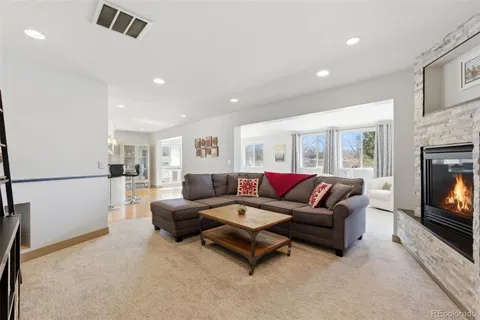 a bathroom with a granite countertop sink mirror and shower