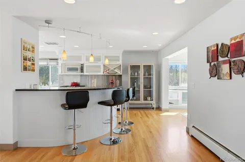 a large kitchen with stainless steel appliances kitchen island a large counter top and stainless steel appliances