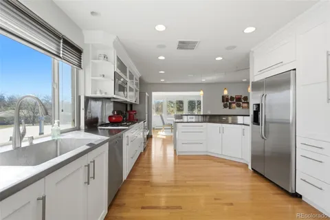 a kitchen with stainless steel appliances cabinets and a counter top space