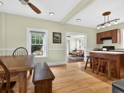 a living room with furniture a wooden floor and a window