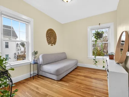 a living room with furniture and a window
