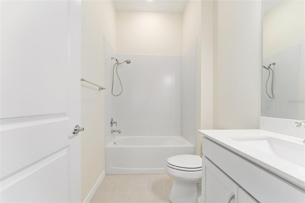 6023 Southwest 86th Circle Ocala, FL 34481 - Photo 33 of 55 a bathroom with a sink toilet vanity and shower