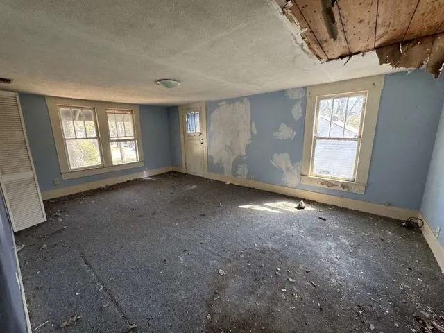 a view of empty room with windows