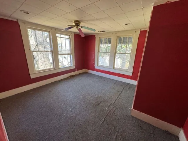 a front view of a house with parking space