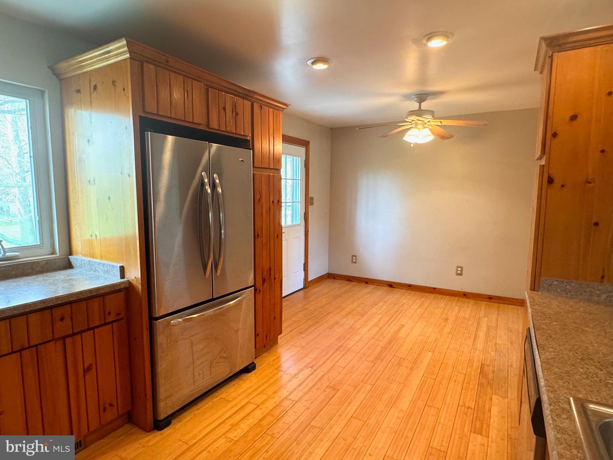 124 Buddtown Road Southampton, NJ 08088 - Photo 8 of 45 a view of a refrigerator in kitchen and wooden floor