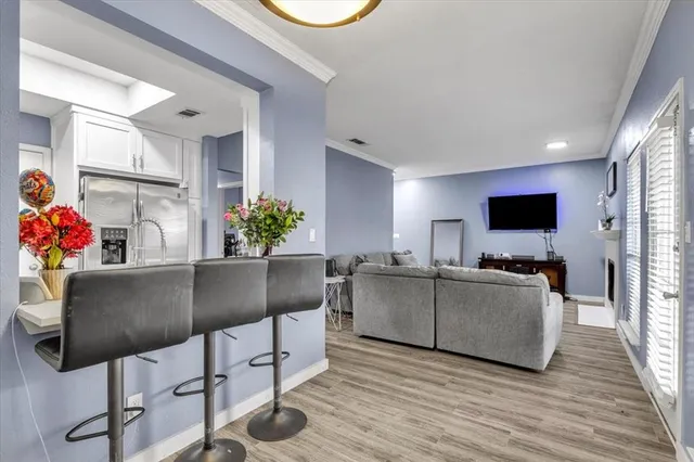 a living room with furniture and flat screen tv