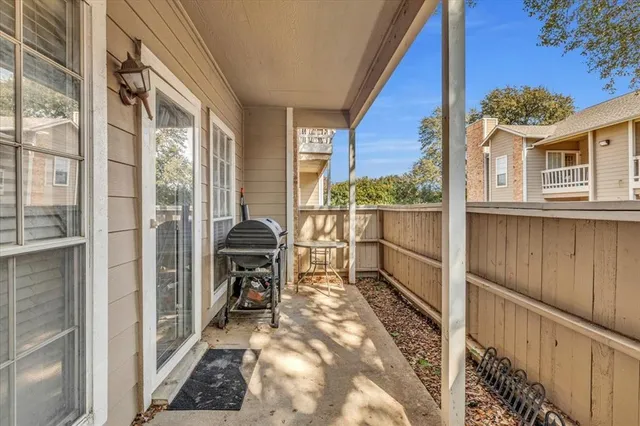 a view of a workspace with furniture and a flat screen tv