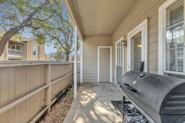 a view of a porch with wooden floor and stairs