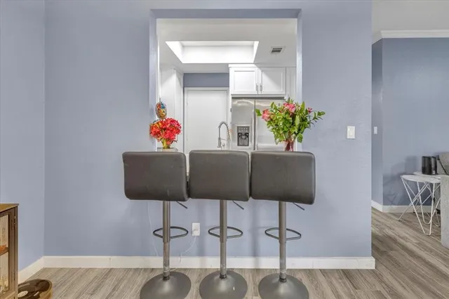 a living room with furniture and flowers