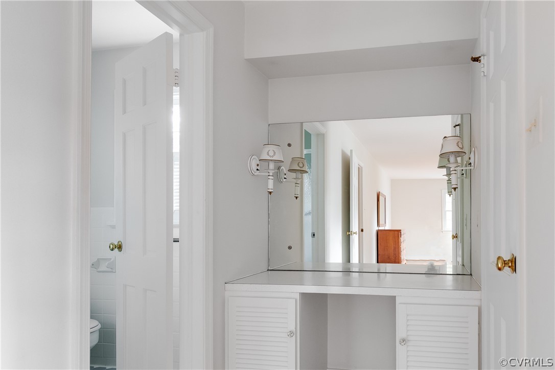 8965 Wishart Road Henrico, VA 23229 - Photo 23 of 38 Vanity area includes a large walk-in closet.