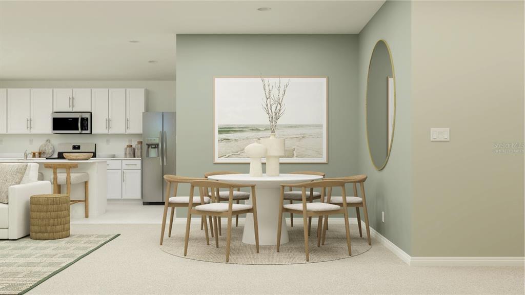 3106 Totem Road Eagle Lake, FL 33839 - Photo 3 of 21 a kitchen with stainless steel appliances a table and chairs