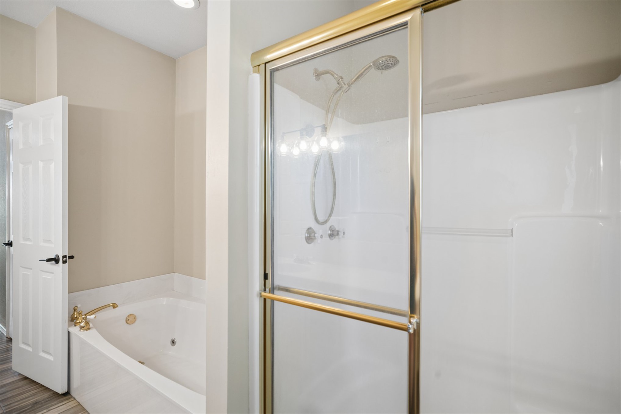 175 Alt 75 Mounds, OK 74047 - Photo 14 of 41 Walk-in shower with gold-tone framed glass enclosure and integrated shelving