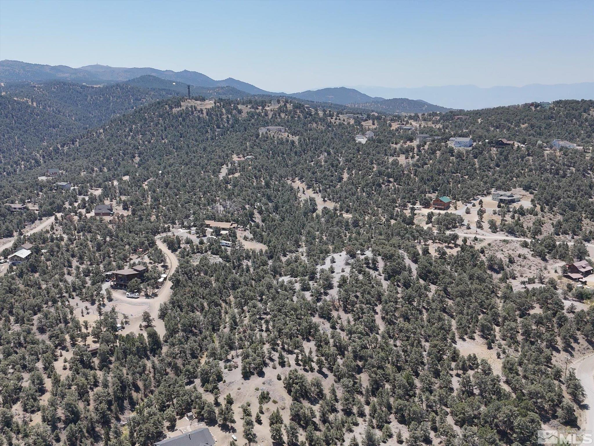 2040 Alpine Road Reno, NV 89521 - Photo 11 of 12 a view of a lush green field with mountains in the background