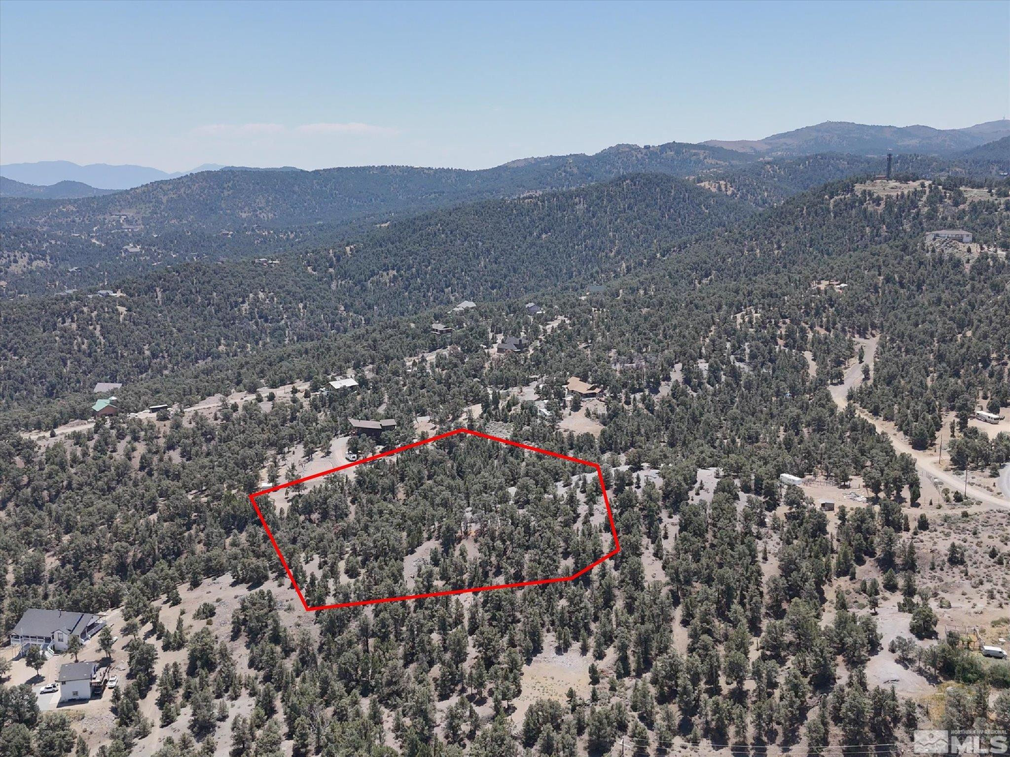 2040 Alpine Road Reno, NV 89521 - Photo 5 of 12 a view of a houses with a lush green hillside