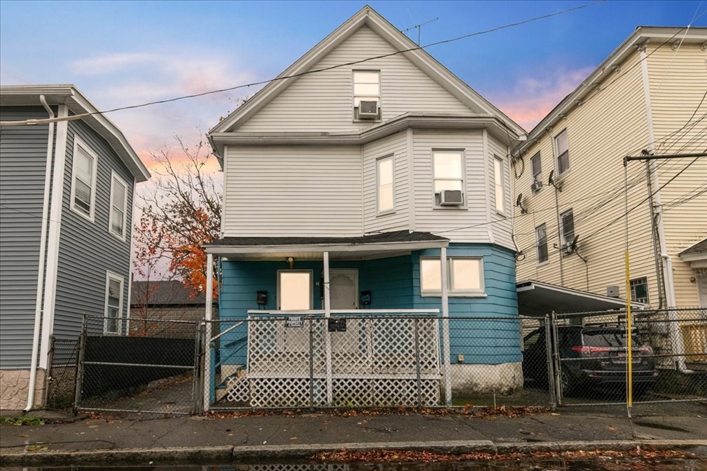 a front view of a house with a garage