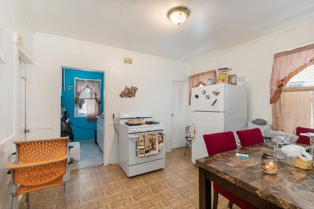 2 Washington Street Lawrence, MA 01841 - Photo 15 of 28 a living room with furniture and a couch