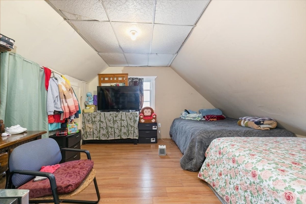 2 Washington Street Lawrence, MA 01841 - Photo 17 of 28 a bedroom with bed and wooden floor
