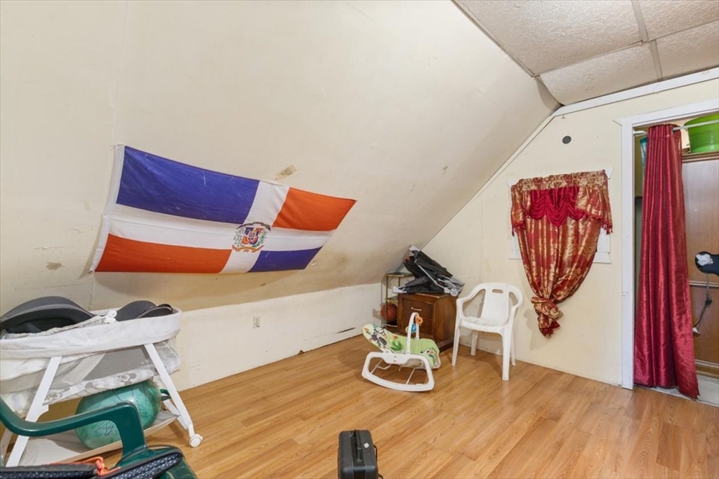 2 Washington Street Lawrence, MA 01841 - Photo 19 of 28 a view of table and chairs in wooden floor