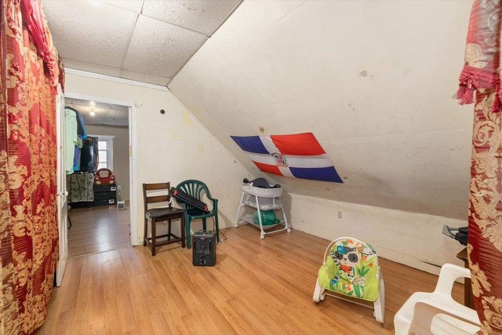 2 Washington Street Lawrence, MA 01841 - Photo 20 of 28 a living room with furniture and wooden floor