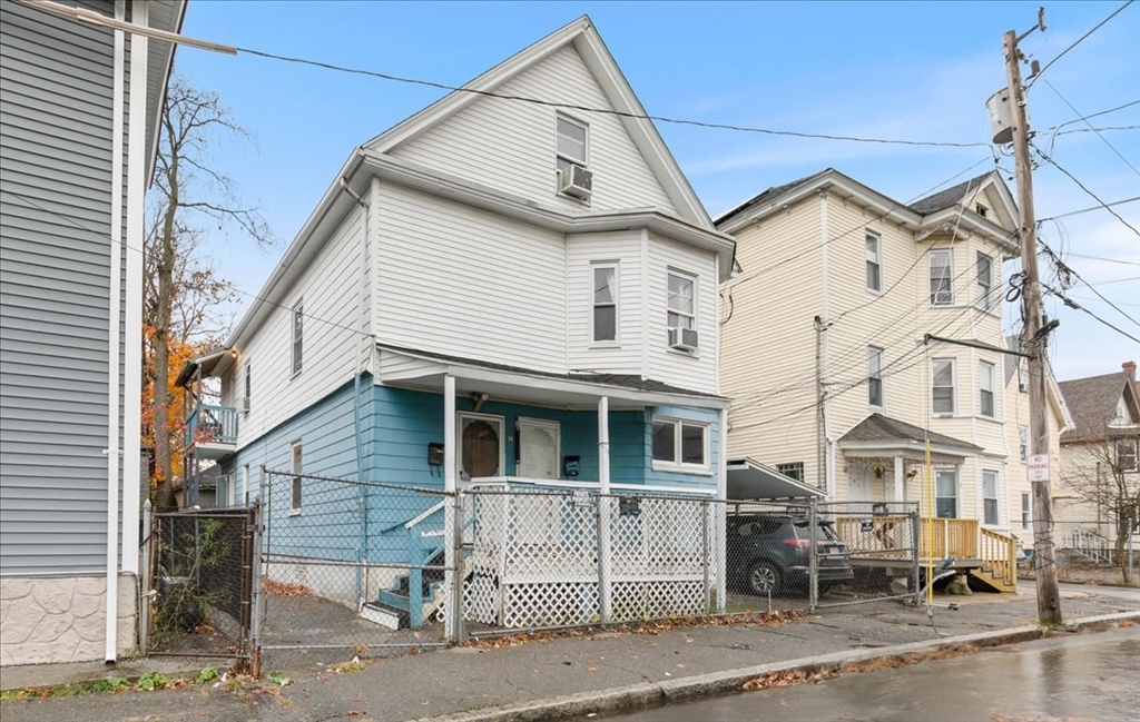 2 Washington Street Lawrence, MA 01841 - Photo 4 of 28 a view of a white building among the street