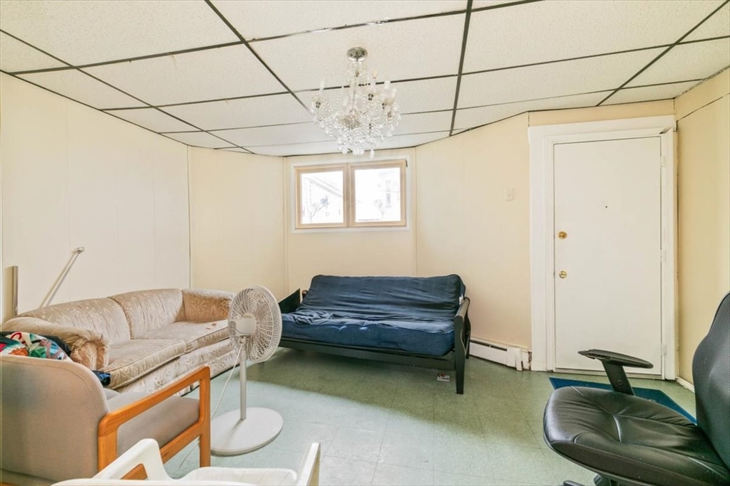 2 Washington Street Lawrence, MA 01841 - Photo 5 of 28 a living room with furniture and a window