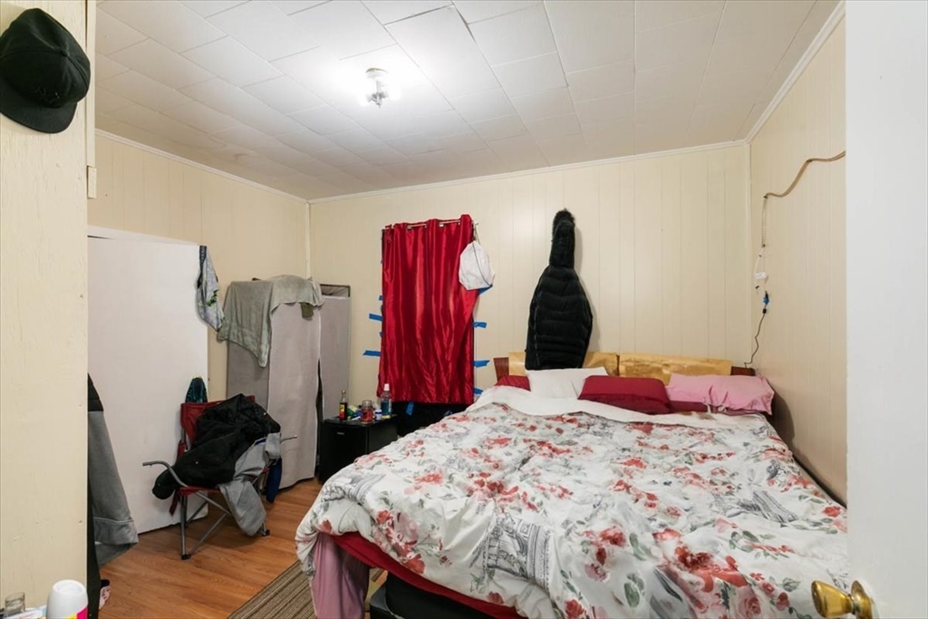 2 Washington Street Lawrence, MA 01841 - Photo 6 of 28 a bed room with a bed and a closet