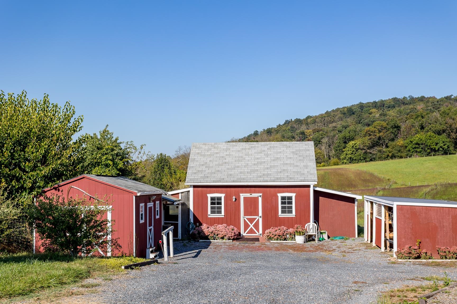 17333 Timberview Drive Timberville, VA 22853 - Photo 20 of 68 a front view of a house with a yard and garage