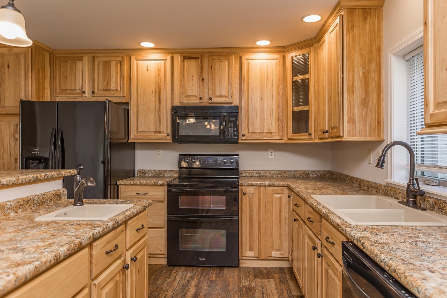 17333 Timberview Drive Timberville, VA 22853 - Photo 30 of 68 a kitchen with kitchen island granite countertop a stove top oven microwave and refrigerator