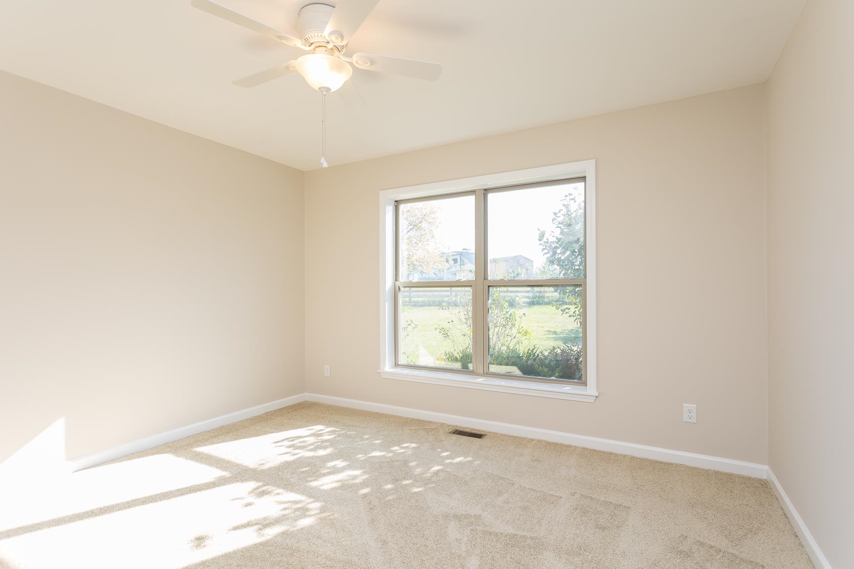 17333 Timberview Drive Timberville, VA 22853 - Photo 43 of 68 an empty room with a window and a fan