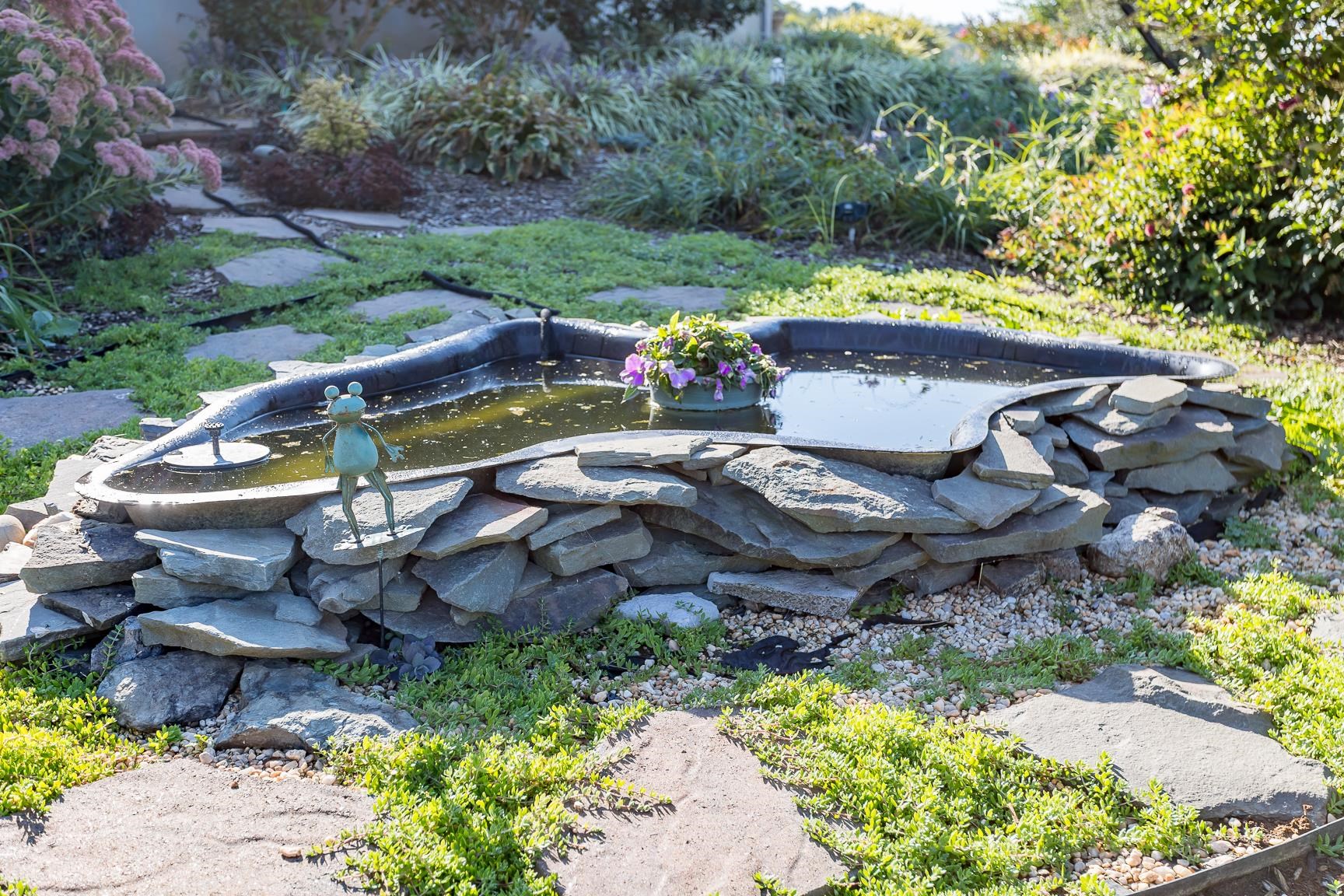 17333 Timberview Drive Timberville, VA 22853 - Photo 53 of 68 a view of a backyard with lawn chairs under an umbrella