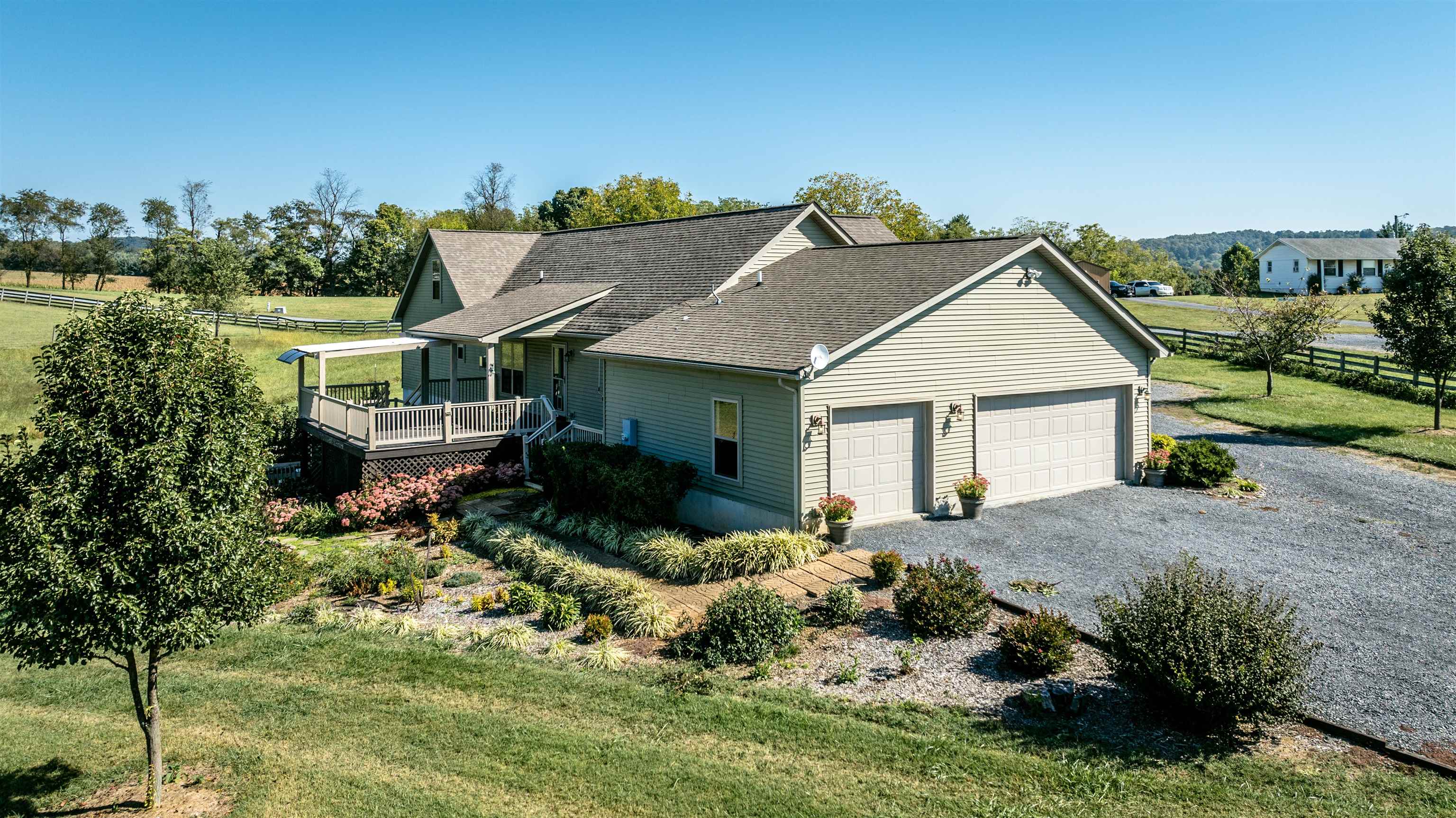 17333 Timberview Drive Timberville, VA 22853 - Photo 6 of 68 a front view of house with yard and trees in the background