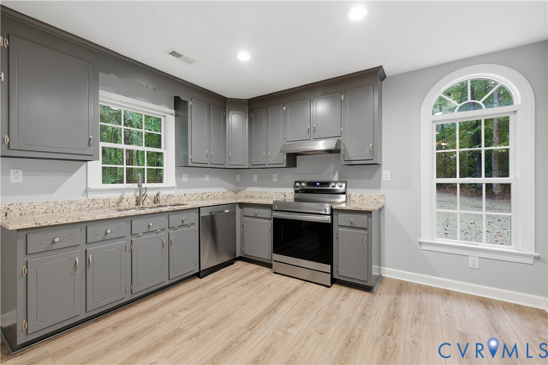 5369 Old Buckingham Road Powhatan, VA 23139 - Photo 15 of 28 Kitchen with gray cabinetry, light granite-style c