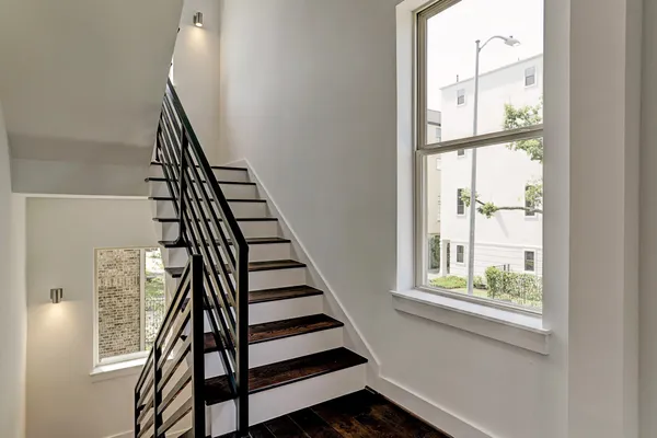 a view of entryway with wooden floor and stairs