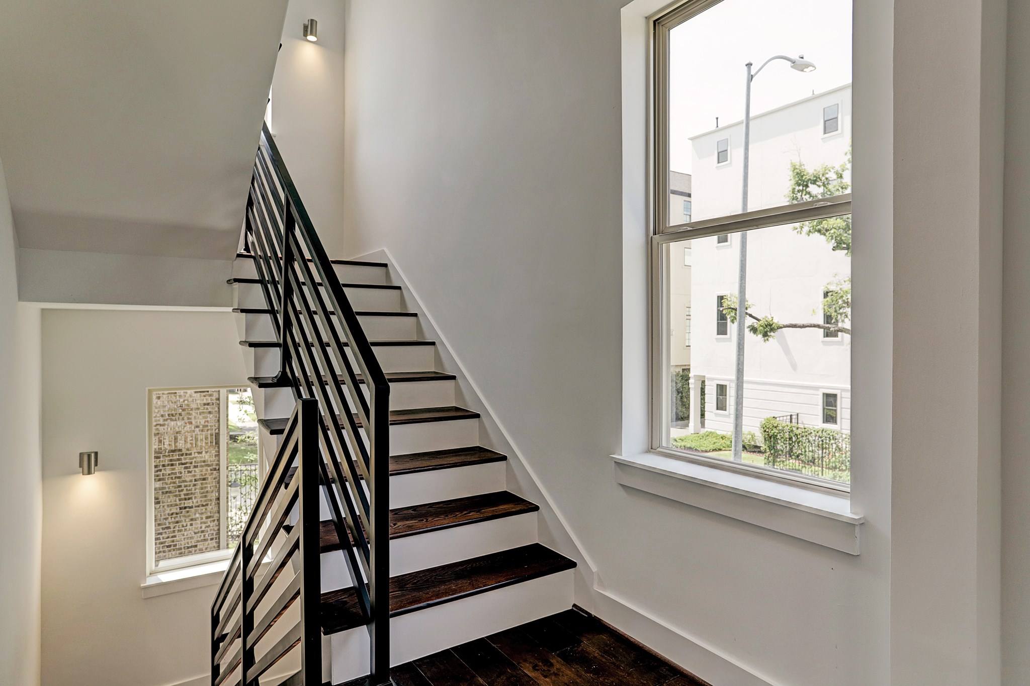 1402 Eberhard Street Houston, TX 77019 - Photo 13 of 50 a view of entryway with wooden floor and stairs
