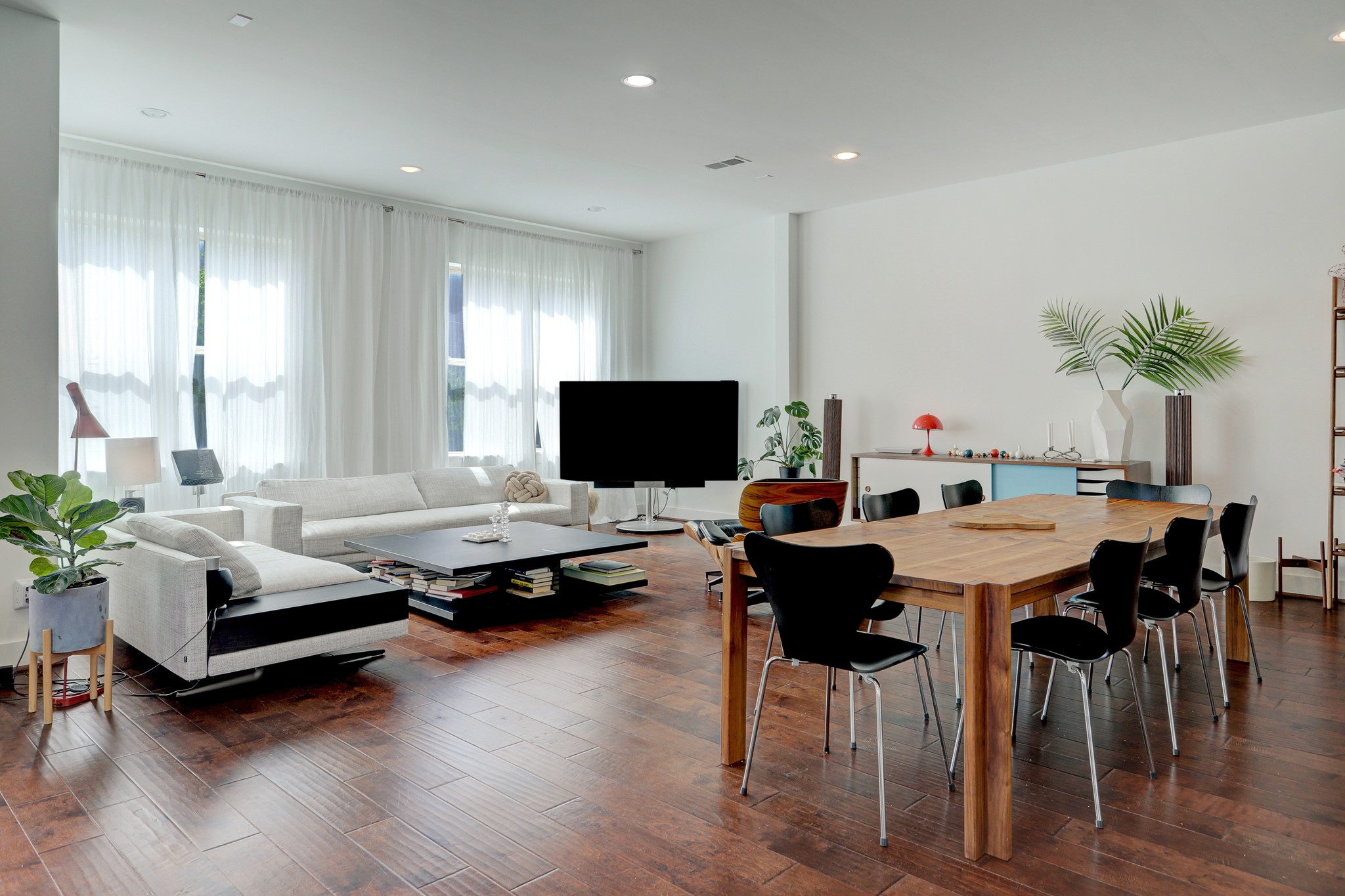 1402 Eberhard Street Houston, TX 77019 - Photo 16 of 50 a living room with furniture flat screen tv and a large window