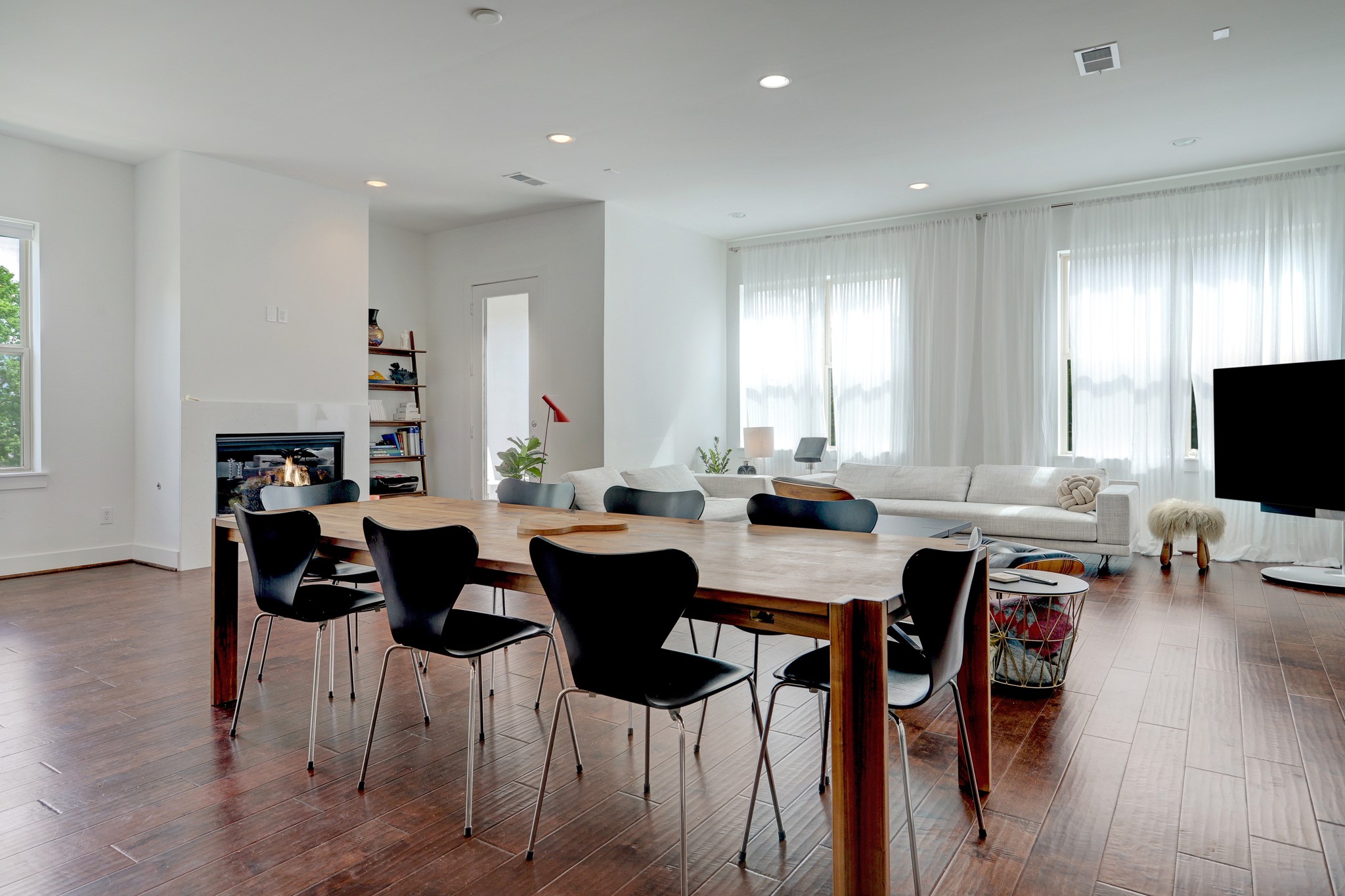 1402 Eberhard Street Houston, TX 77019 - Photo 19 of 50 a view of a dining room with furniture and wooden floor