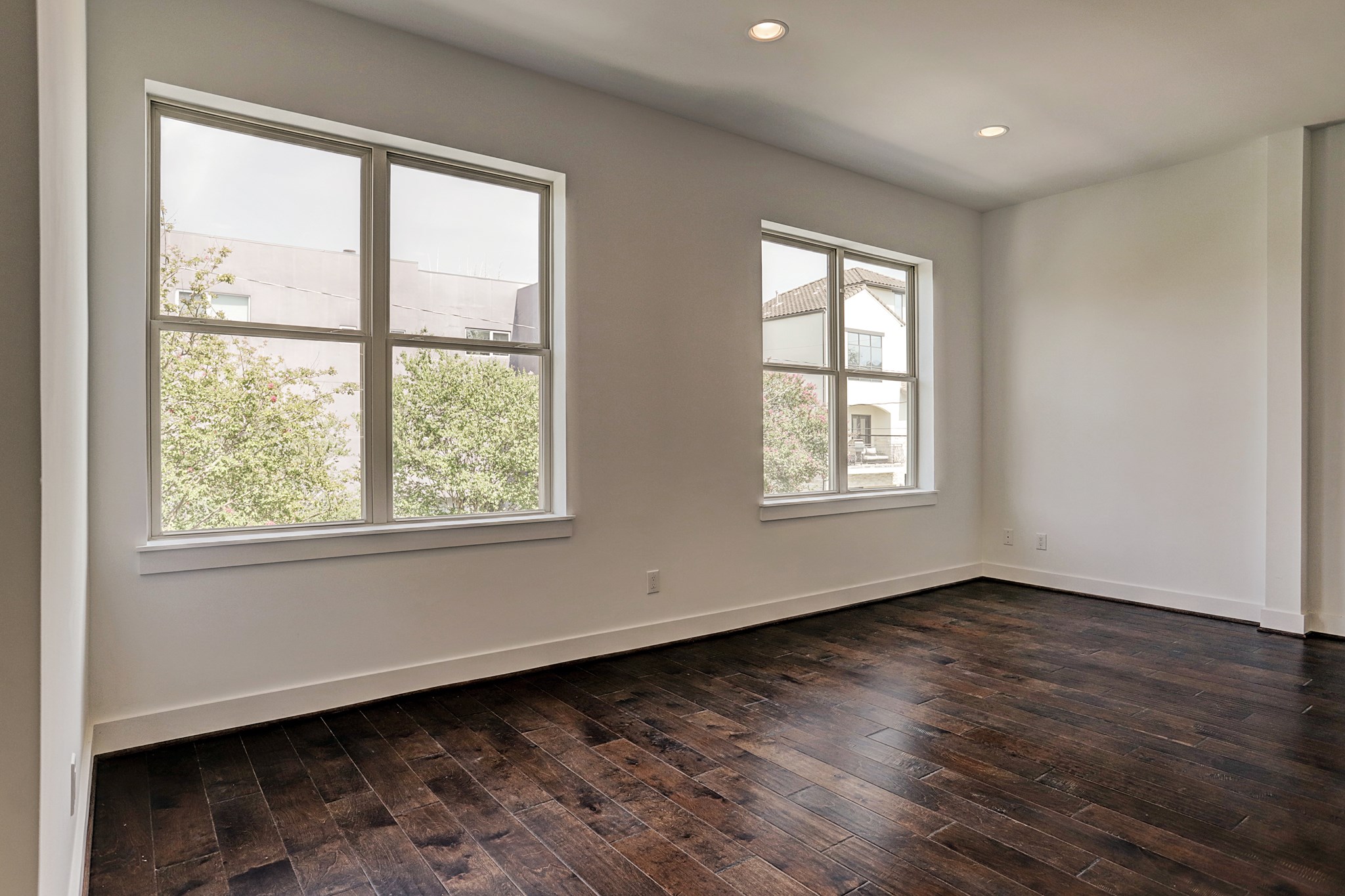 1402 Eberhard Street Houston, TX 77019 - Photo 22 of 50 a view of an empty room with wooden floor and a window