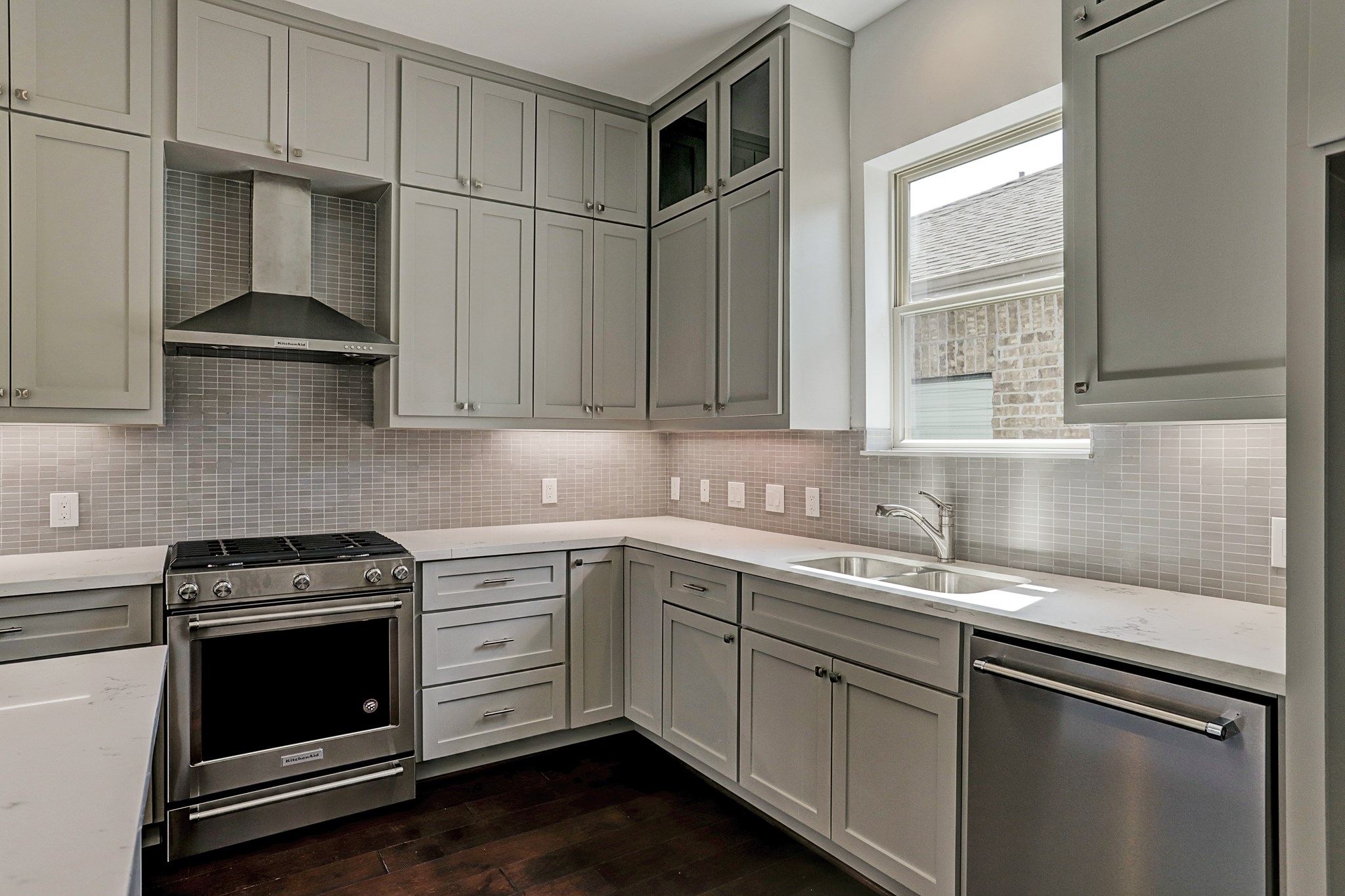 1402 Eberhard Street Houston, TX 77019 - Photo 25 of 50 a kitchen with stainless steel appliances a sink stove and cabinets