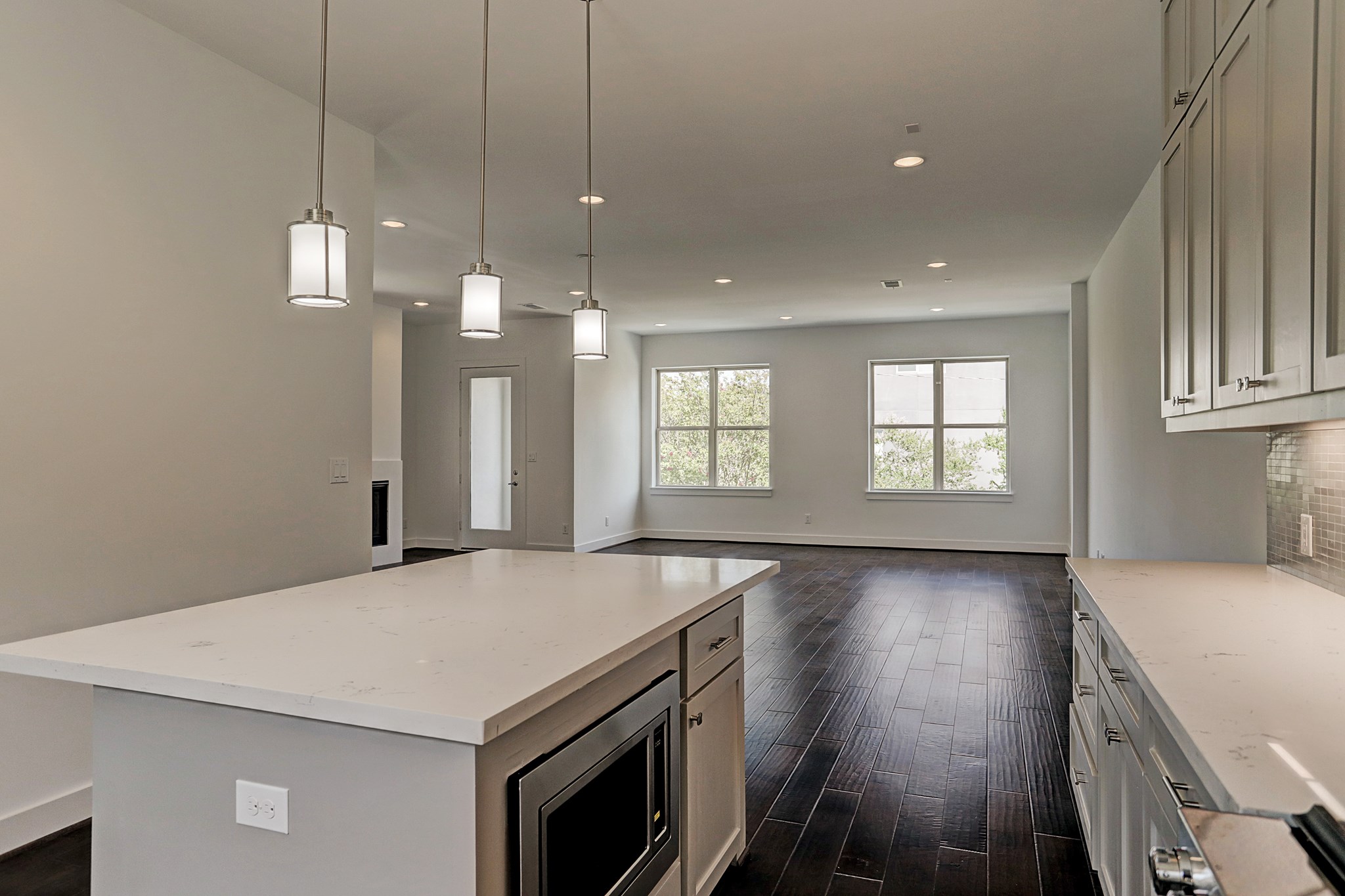 1402 Eberhard Street Houston, TX 77019 - Photo 26 of 50 GENEROUS ISLAND SPACE WITH NEARBY MICROWAVE AND CABINETS CREATE SUCH A FUNCTIONAL AND FUN KITCHEN!
