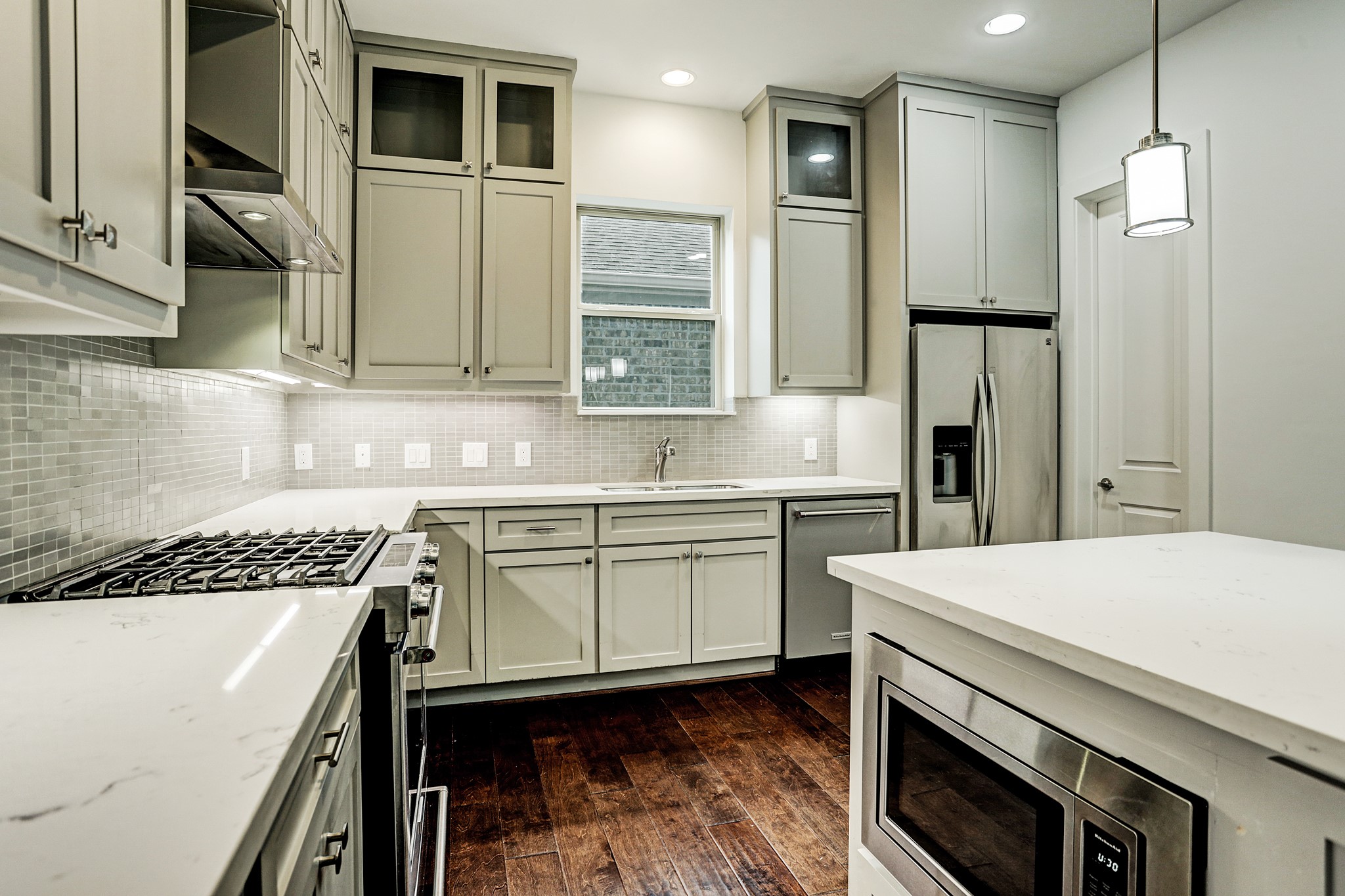 1402 Eberhard Street Houston, TX 77019 - Photo 29 of 50 a kitchen with a sink appliances and cabinets