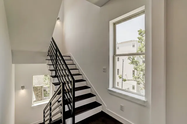 a room with gym equipment and a large window
