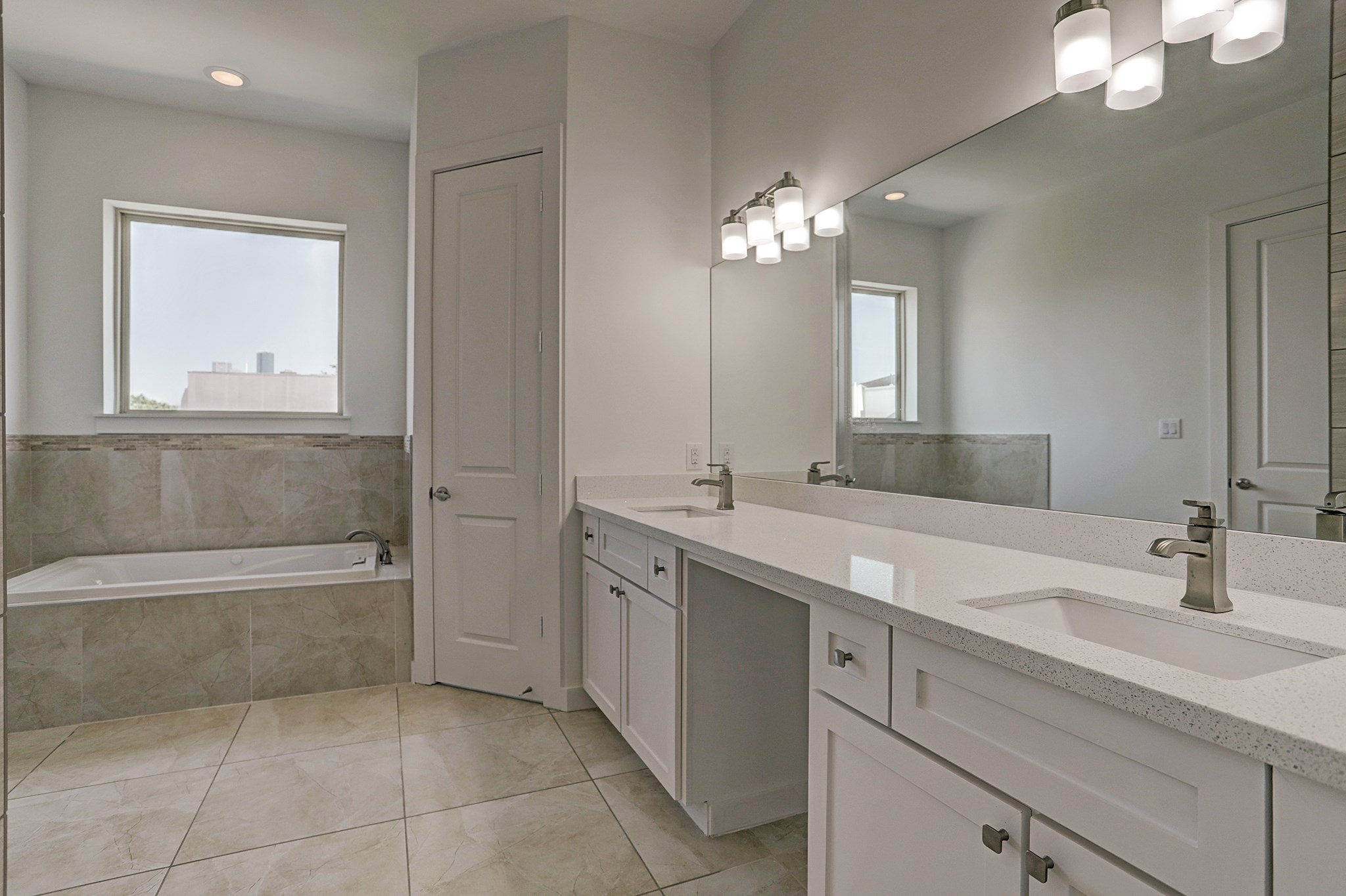 1402 Eberhard Street Houston, TX 77019 - Photo 36 of 50 a bathroom with a tub sink and mirror