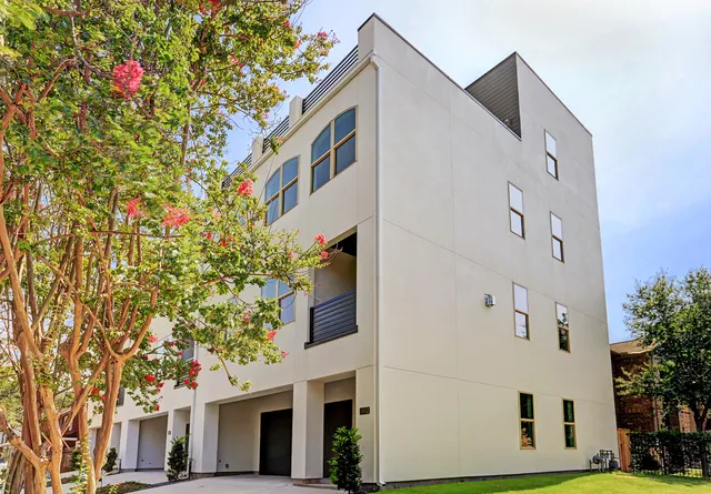 a view of a hallway with wooden floor and stairs